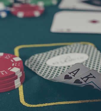 Poker chips and cards on the casino hotel gaming floor